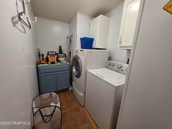 a view of dirt yard with large trees