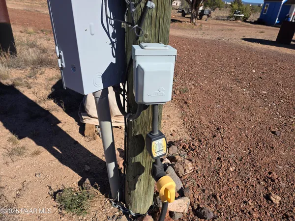 a kitchen with stainless steel appliances granite countertop a table chairs sink and cabinets