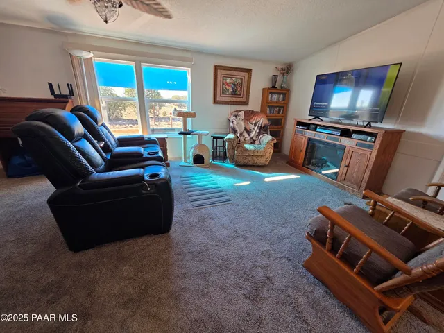 a kitchen with stainless steel appliances granite countertop a refrigerator stove top oven and sink