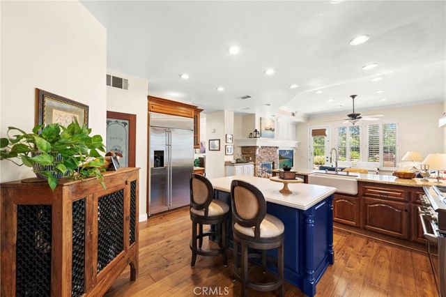 a large white bathroom with a large tub sink shower and mirror