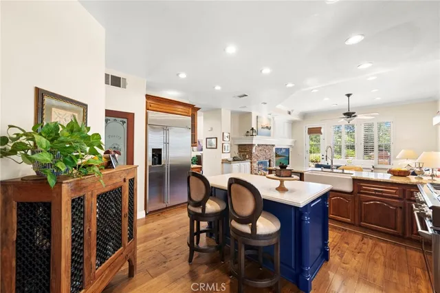 a large white bathroom with a large tub sink shower and mirror