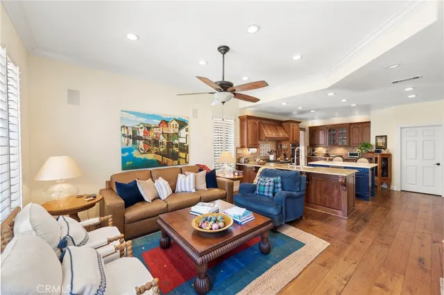 a large white kitchen with a sink and dishwasher with white cabinets