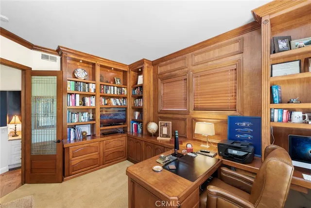 a bedroom with a bed a lamp and a window