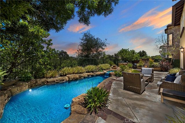 a living room with furniture a rug and a window
