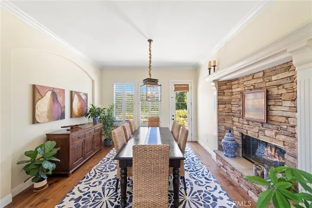 a living room with furniture fireplace and a large window