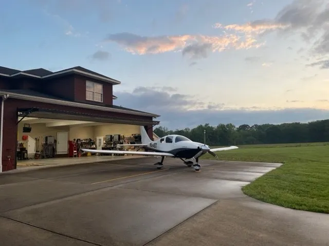 a view of a car park in front of a house