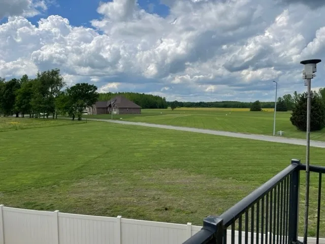 a view of a golf course with a lake