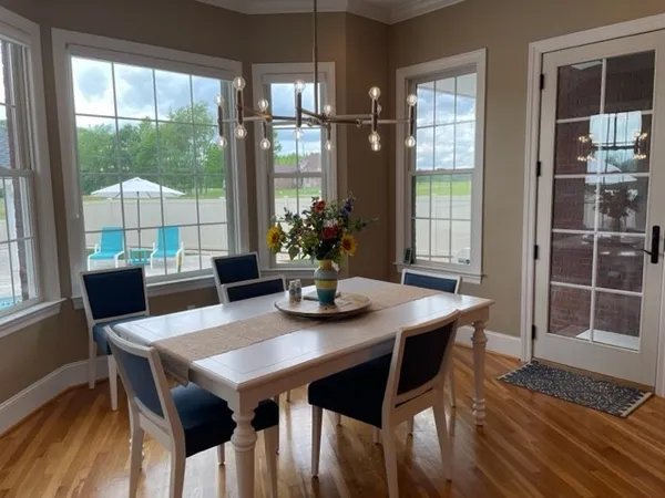 a kitchen with stainless steel appliances granite countertop a sink refrigerator and cabinets