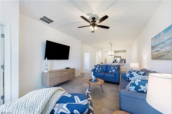 a view of hallway with livingroom and furniture