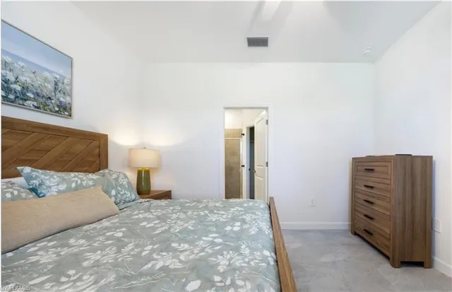 a bathroom with a shower sink and mirror