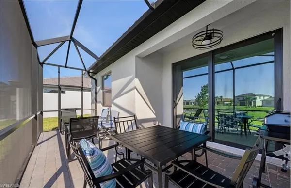 a view of a grassy field with an trees