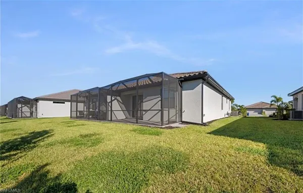 a view of a lake with houses in the back