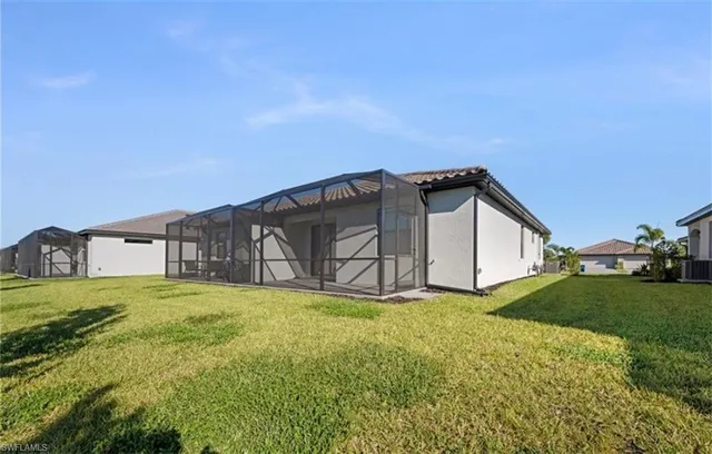 a view of a lake with houses in the back