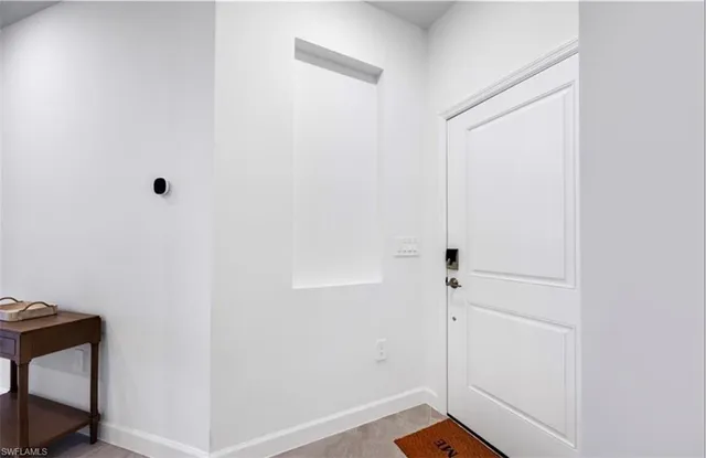 a kitchen with cabinets and a stove