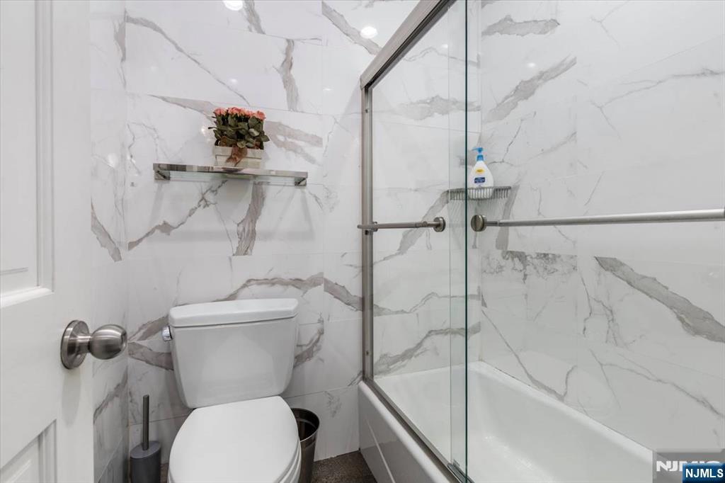 116 Westervelt Place Passaic, NJ 07055 - Photo 14 of 25 a bathroom with a toilet and a shower