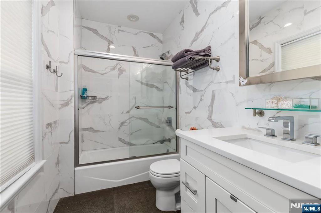 116 Westervelt Place Passaic, NJ 07055 - Photo 16 of 25 a bathroom with a sink toilet and shower