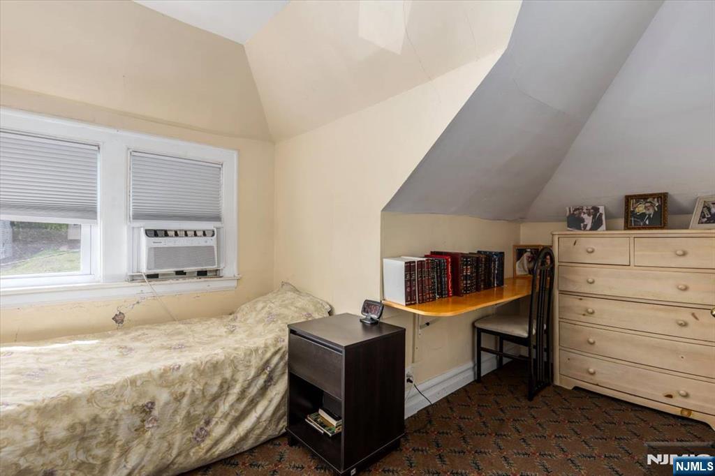 116 Westervelt Place Passaic, NJ 07055 - Photo 19 of 25 a bedroom with a bed and furniture