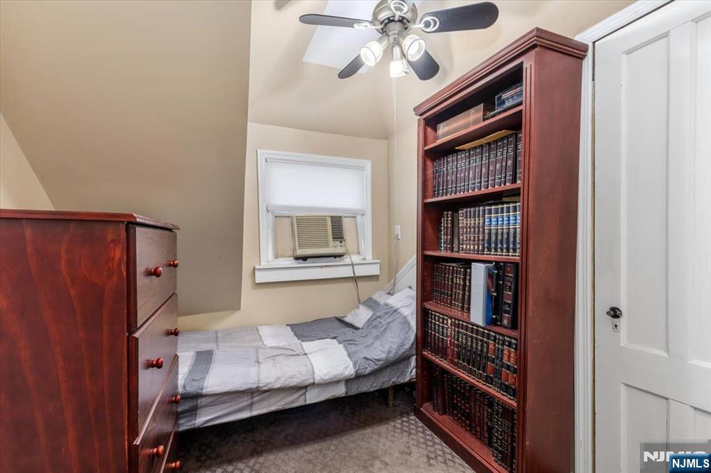 116 Westervelt Place Passaic, NJ 07055 - Photo 20 of 25 a bedroom with a bed and furniture
