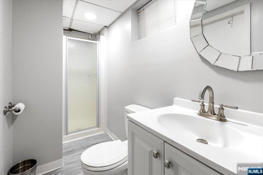 116 Westervelt Place Passaic, NJ 07055 - Photo 23 of 25 a bathroom with a sink toilet and shower