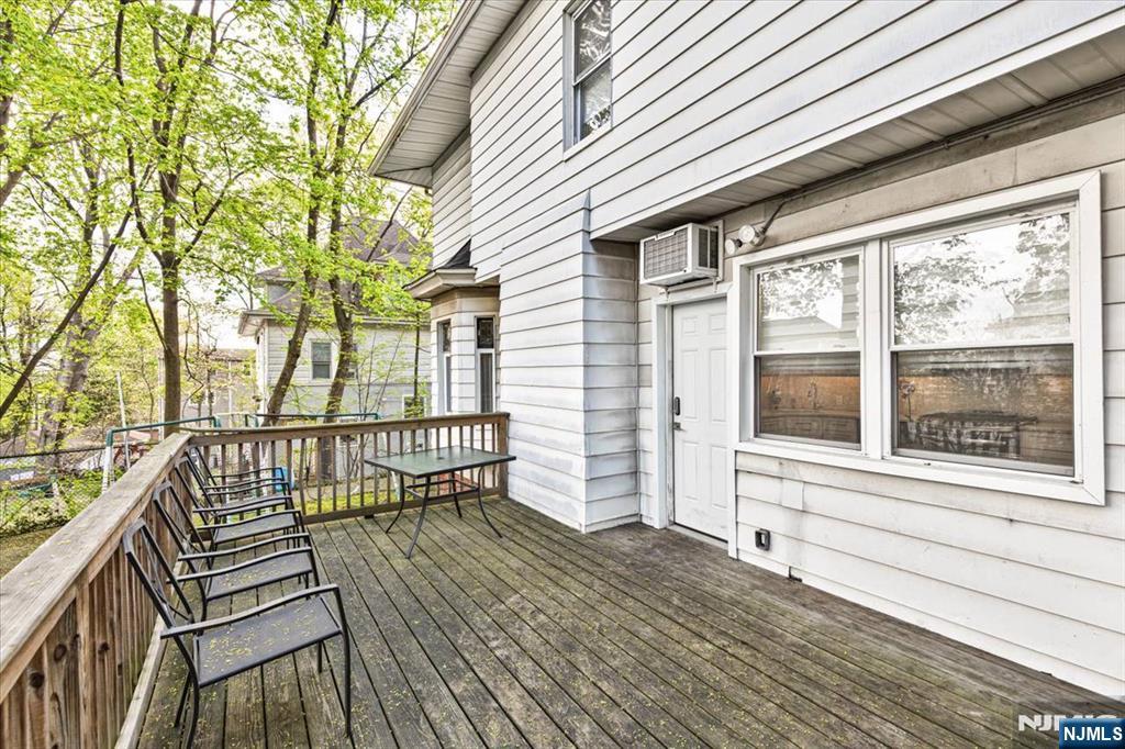 116 Westervelt Place Passaic, NJ 07055 - Photo 25 of 25 a view of a balcony with wooden floor and fence