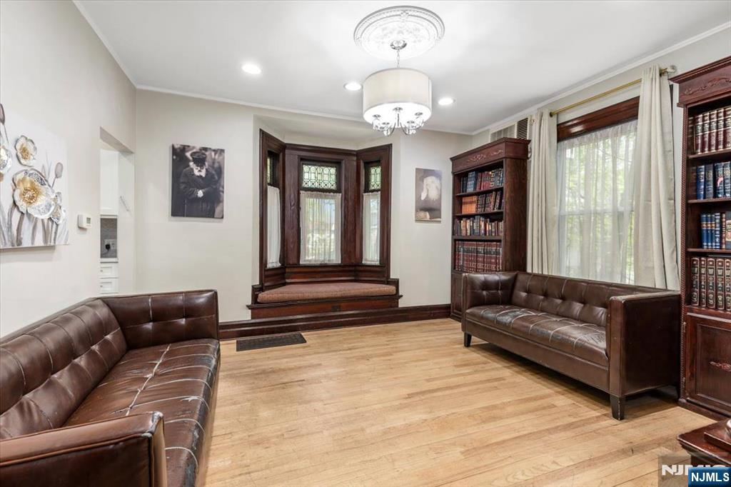 116 Westervelt Place Passaic, NJ 07055 - Photo 7 of 25 a living room with furniture and a large window