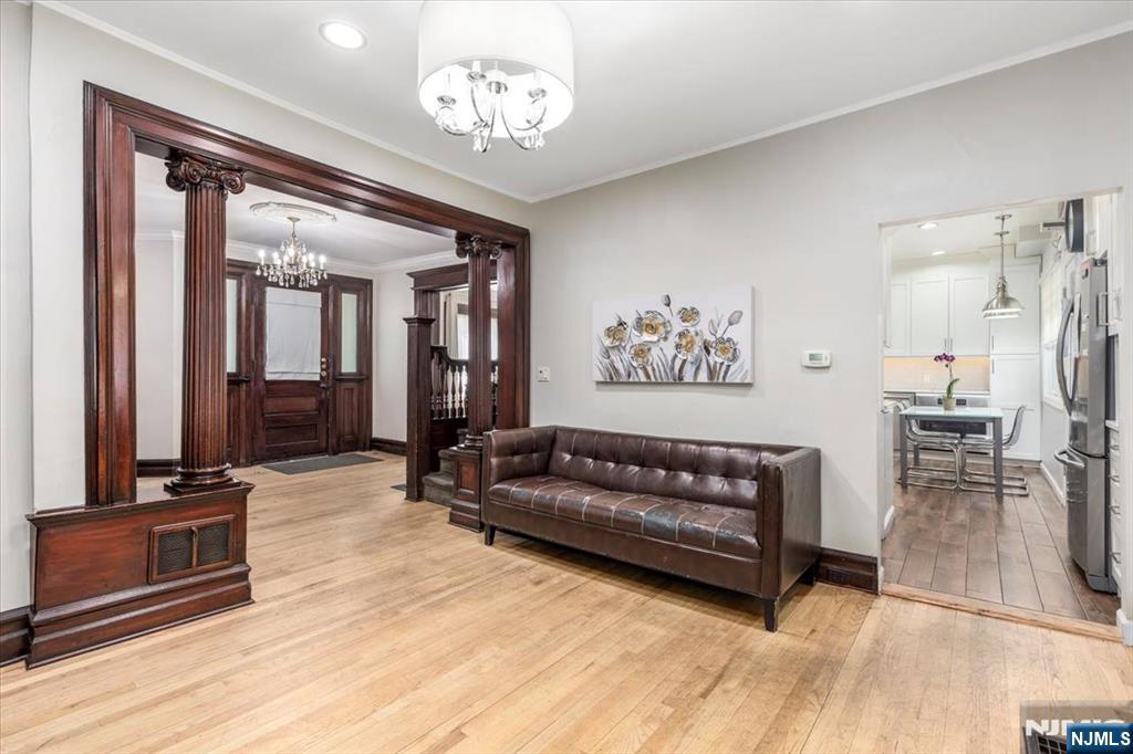 116 Westervelt Place Passaic, NJ 07055 - Photo 8 of 25 a view of a livingroom with furniture and a chandelier