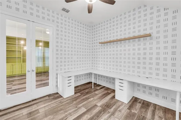 a view of a livingroom with wooden floor