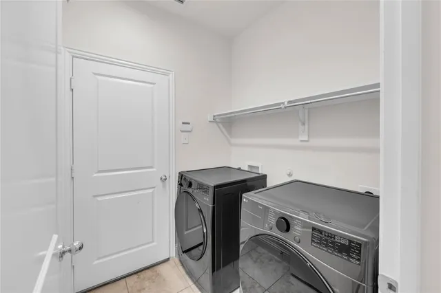 a view of an empty room with closet