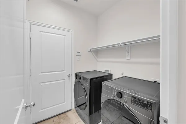 a view of an empty room with closet