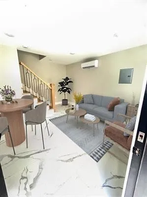 a living room with furniture and a table