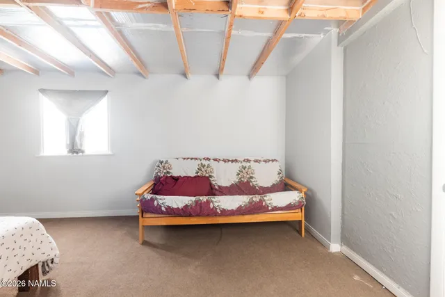 a view of living room with furniture and a fireplace