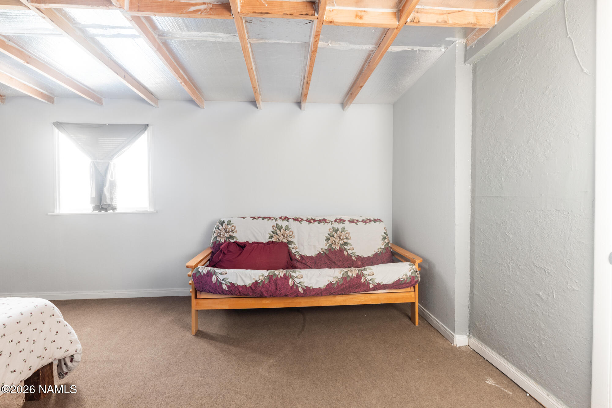 8509 West Thunder Valley Road, Unit 921 Williams, AZ 86046 - Photo 34 of 41 a bed sitting in a bedroom next to a window