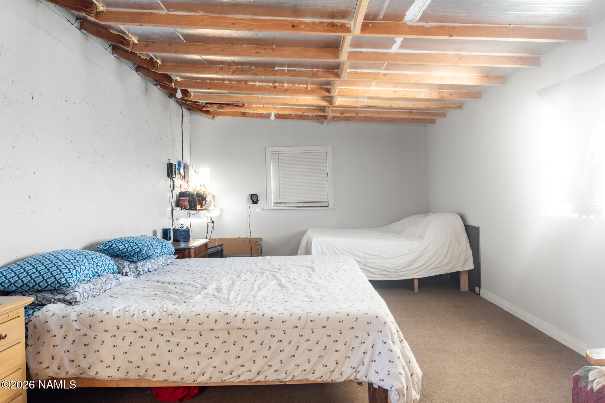 8509 West Thunder Valley Road, Unit 921 Williams, AZ 86046 - Photo 35 of 41 a bedroom with a large bed and chandelier