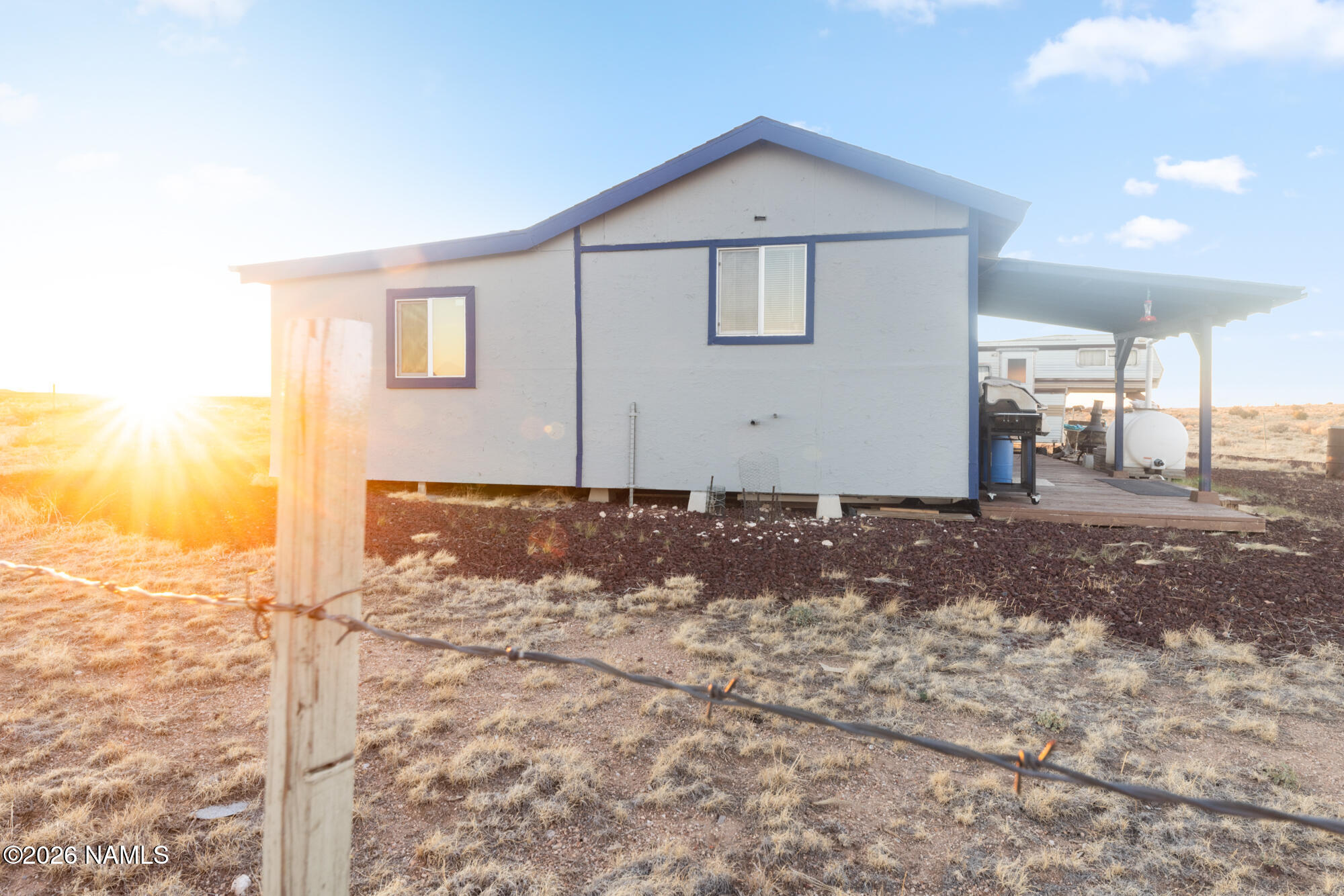 8509 West Thunder Valley Road, Unit 921 Williams, AZ 86046 - Photo 41 of 41 a front view of a house with a yard