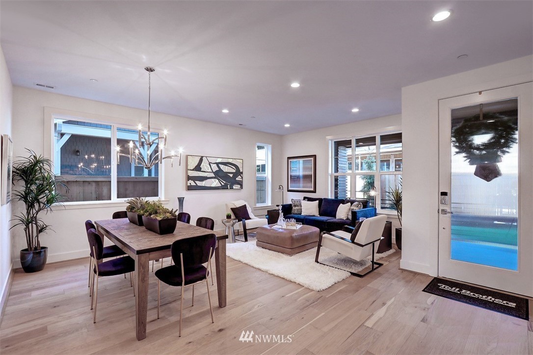 102 232nd Place Southeast, Unit 13 Bothell, WA 98021 - Photo 2 of 26 a living room with furniture and a chandelier
