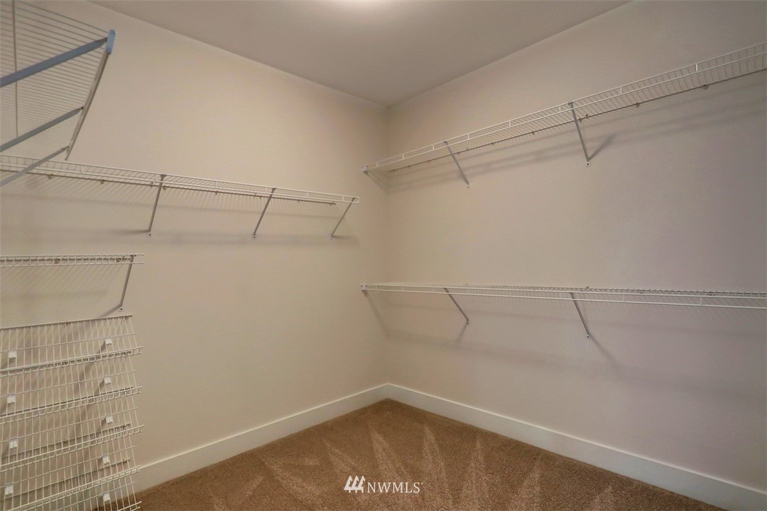 102 232nd Place Southeast, Unit 13 Bothell, WA 98021 - Photo 16 of 26 a view of a room with racks on the wall