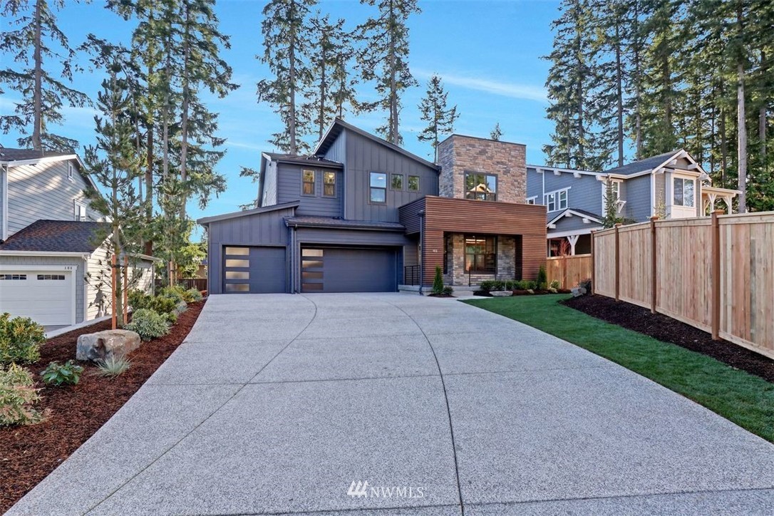 102 232nd Place Southeast, Unit 13 Bothell, WA 98021 - Photo 22 of 26 a front view of a building with garden
