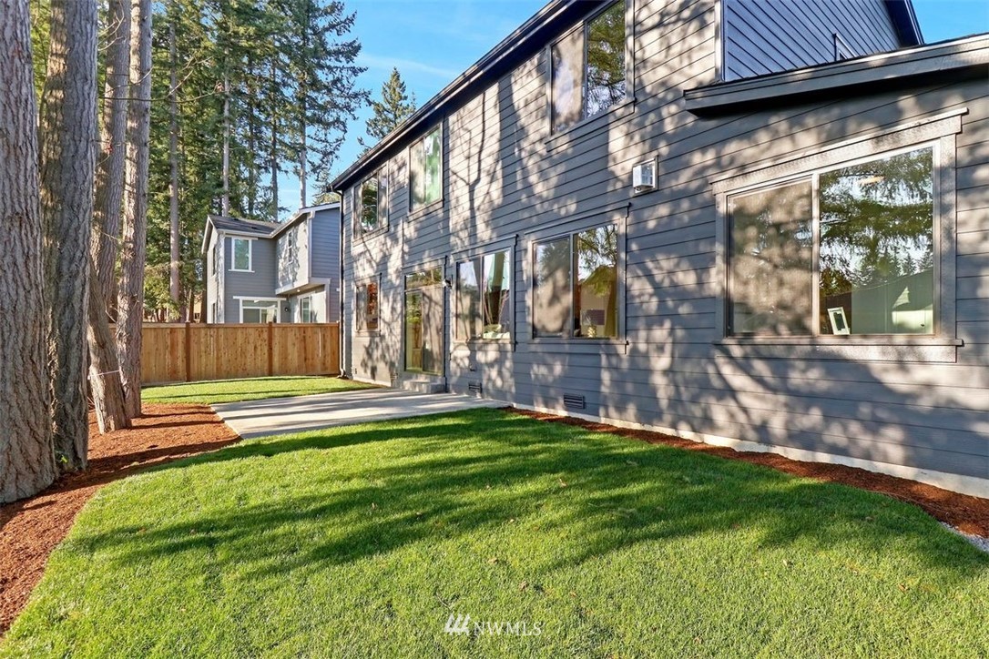 102 232nd Place Southeast, Unit 13 Bothell, WA 98021 - Photo 24 of 26 a view of a house with a yard