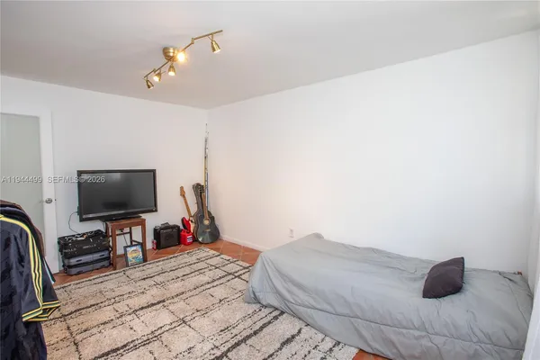a group of people sitting in a kitchen