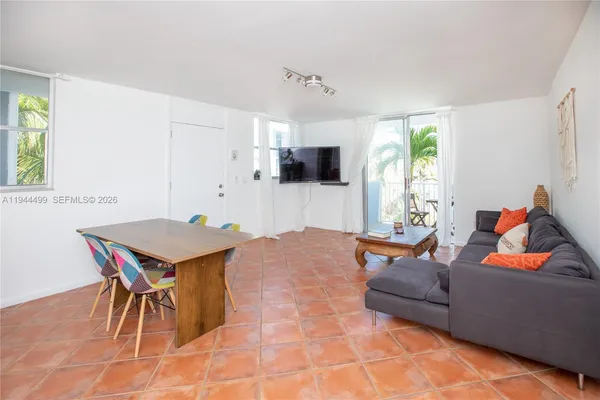 a kitchen with a table and chairs