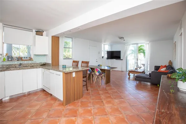 a view of kitchen with furniture and window
