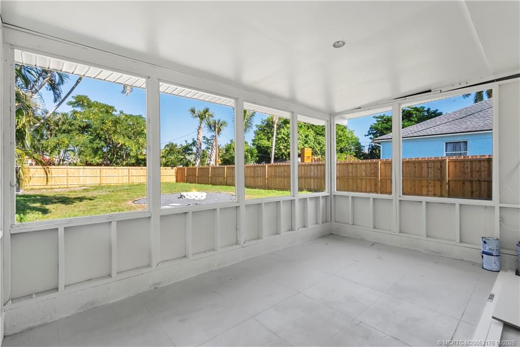 3023 Southeast Banyan Street Stuart, FL 34997 - Photo 21 of 24 an empty room with large windows