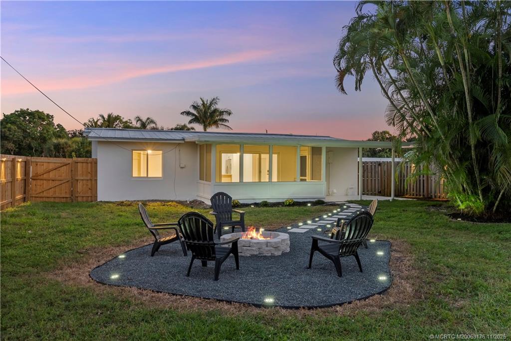 3023 Southeast Banyan Street Stuart, FL 34997 - Photo 5 of 24 a view of a house with backyard porch and sitting area