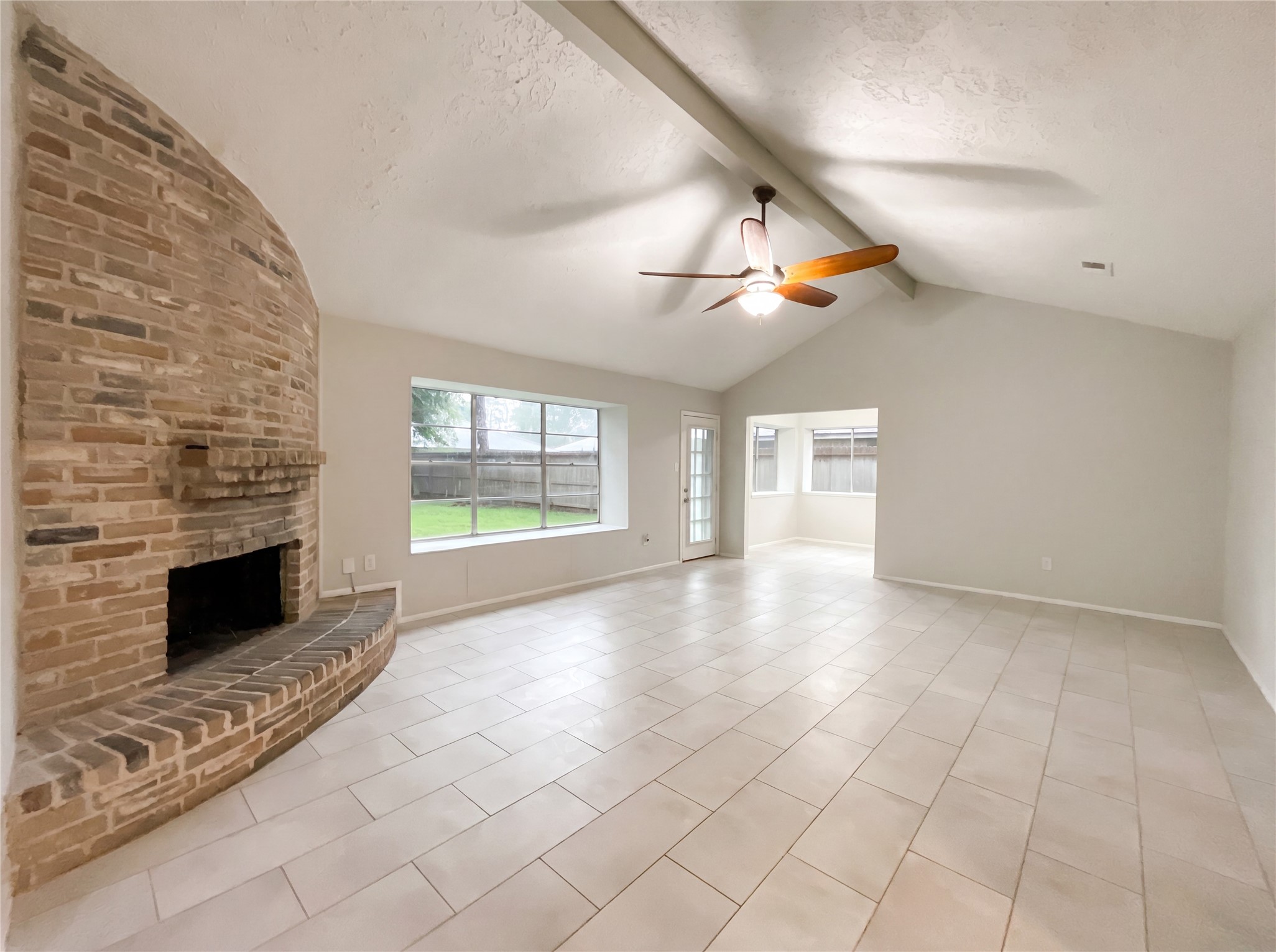 23110 Pennsgrove Road Spring, TX 77373 - Photo 9 of 16 an empty room with windows and fireplace