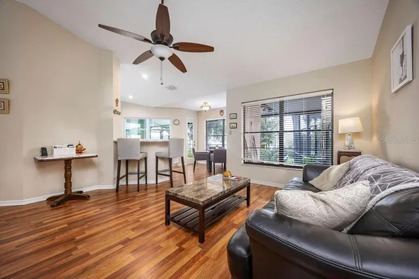a living room with furniture and a window