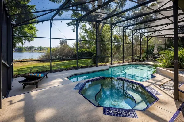 a swimming pool with outdoor seating