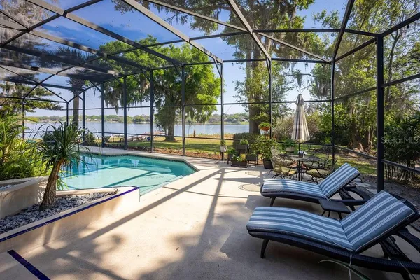 a view of a patio with a table and chairs