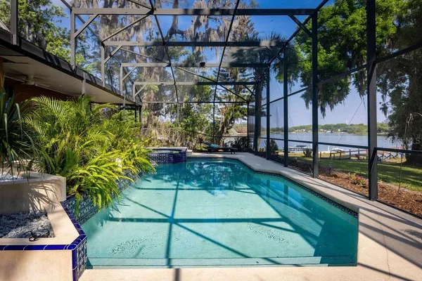 a view of a swimming pool with a patio