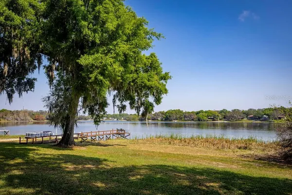 a view of a lake with houses in the background