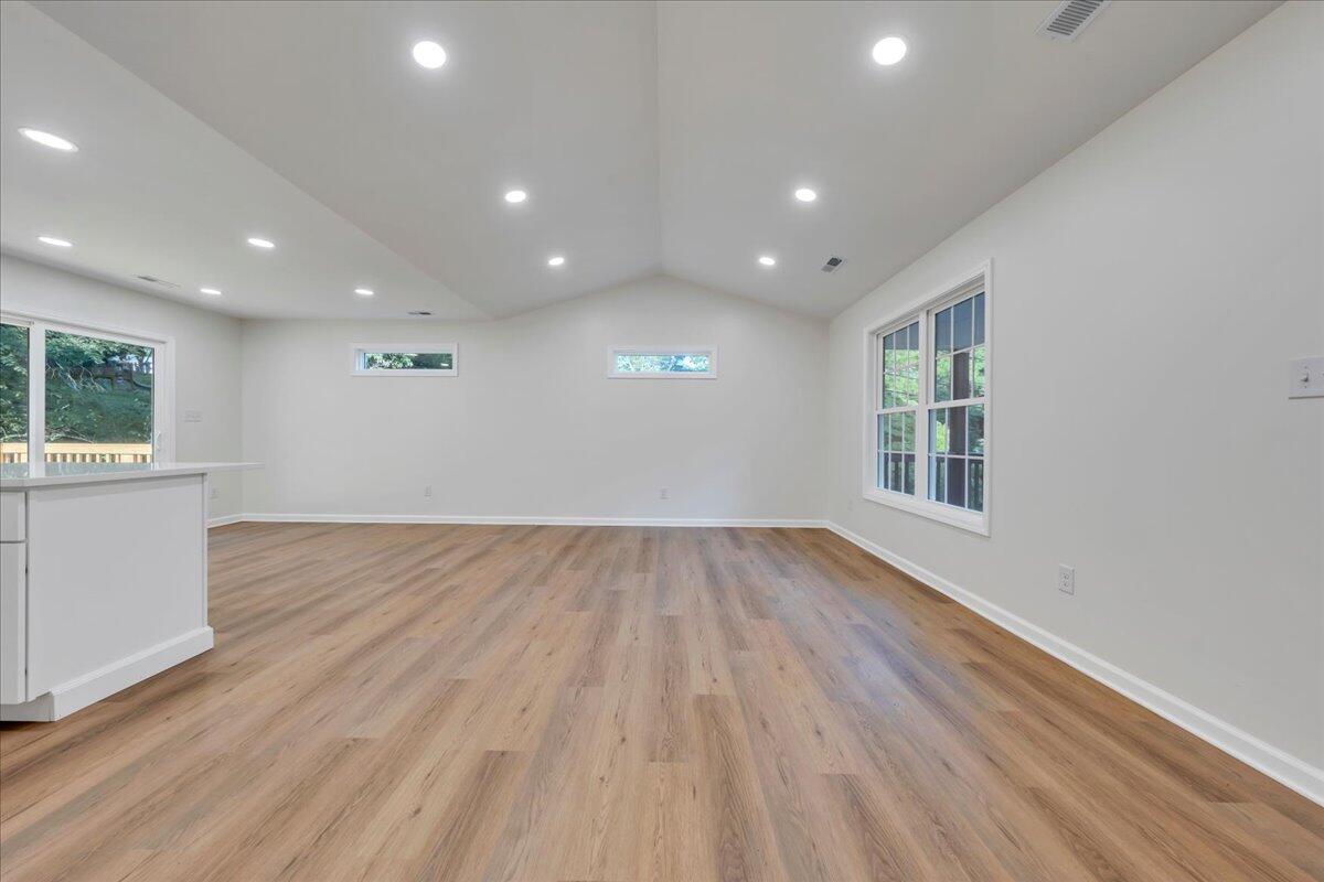 3713 Pinevale Road Roanoke, VA 24018 - Photo 13 of 46 an empty room with wooden floor and windows